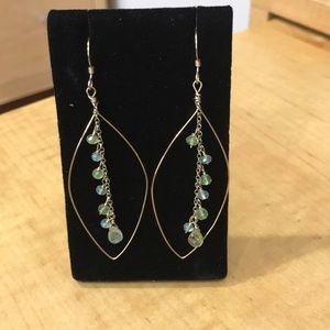 Lightweight gold drop earrings with beads.